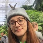 Gretchen Shelby-Dormer, smiling, with a butterfly on her head.